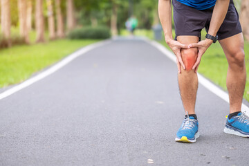 Young adult male with muscle pain during running. runner have knee ache due to Runners Knee or Patellofemoral Pain Syndrome, osteoarthritis and Patellar Tendinitis. Sports injuries and medical concept