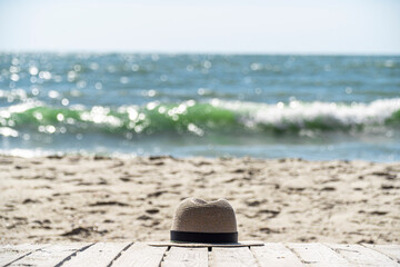 hat on a platform near the sea