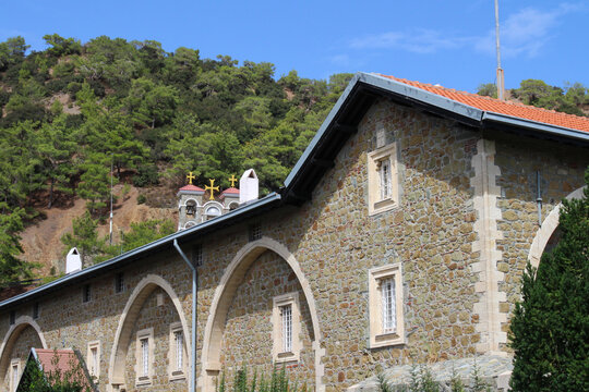 The building of the Kykkos monastery, where the Kykkos icon of the mother of God is kept, in the Troodos mountains against the blue sky. Cyprus.