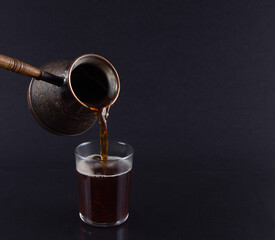 Freshly Brewed Turkish Coffee Poured from Cezve..