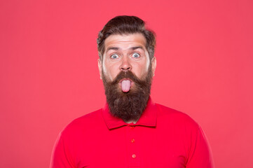 Pink tongue. Bearded and cheerful. Hipster appearance. Beard fashion. Barber concept. Man bearded...