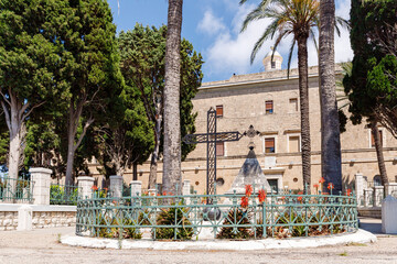 Monuments with a metal crosses in front of the facade of the Stella Maris Monastery which is located on Mount Carmel in Haifa city in northern Israel - obrazy, fototapety, plakaty