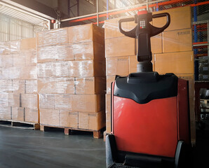 Electric forklift pallet jack loading with stack shipment boxes. Cargo & shipping warehouse, Logistics and transportation.