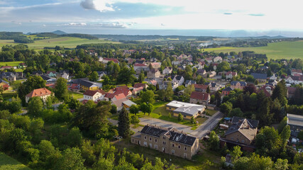 Fototapeta na wymiar air view of Leutersdorf and the mountains nearby in saxony