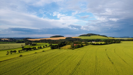 Fototapeta premium air view of Leutersdorf and the mountains nearby in saxony