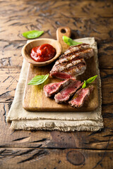 Grilled beef steak with tomato sauce