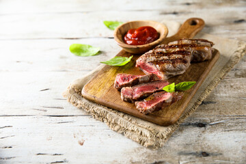 Grilled beef steak with tomato sauce