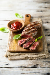 Grilled beef steak with tomato sauce