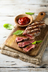 Grilled beef steak with tomato sauce
