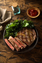Grilled beef steak with tomato sauce