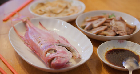 Hong Kong style home cuisine, family dinner concept, steamed fish, fry vegetable and meat