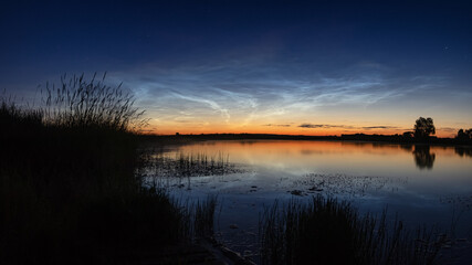 Ural landscape at night on the river with silvery clouds, Russia, Ural Sverdlovsk region