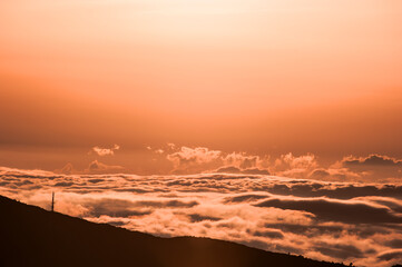 Beautiful sea of clouds at sunset on the top of the mountain.