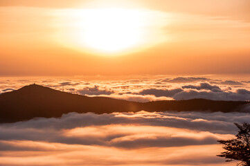 Beautiful sea of clouds at sunset on the top of the mountain.