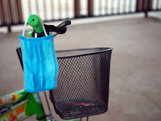 Face mask Hanging from the bike to be ready at all times At an unusual time. new normal concept....