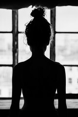 Naked woman near the window