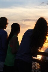 silhouette of a sisters at sunset