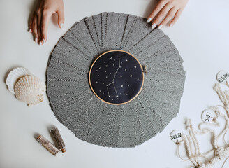 woman with tarot cards circle on the table