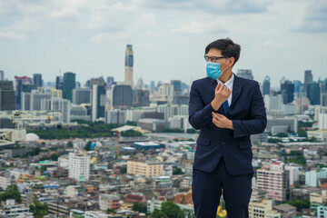 Bangkok Thailand encountered heavy dust pollution problems men wearing air-protective masks with dust 2.5 Particulate Matte in the air are polluting the capital of Bangkok 