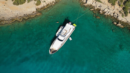 Aerial drone photo of yacht - boat with wooden deck anchored in tropical exotic paradise with...