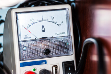 Ammeter close-up. Current, device with a white dial, electricity, measuring device, technology.