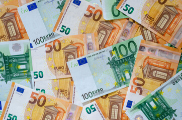 Background of many euro currency notes.