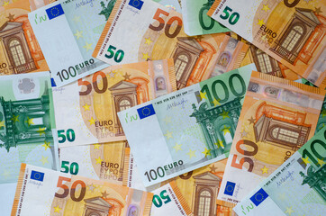 Background of many euro currency notes.
