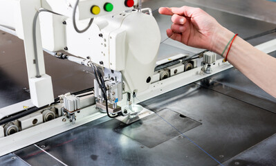 Fabric industry production line. Textile factory. Working tailoring process