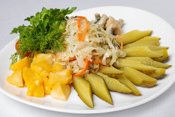 Mixed pickled vegetable salad. Concept of healthy vegetarian meal. Close up