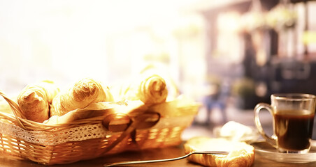 Fresh pastries on the table. French flavored croissant and coffee.