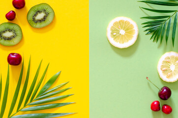 Bright colorful background with exotic painted tropical palm leaves and fruit.