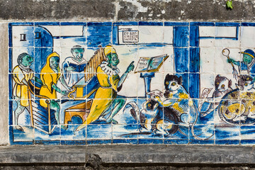 detail of old azulejos showing musician and barber cats in the palace of the Marquis de Fronteira in Lisbon, Portugal