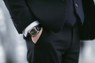 Closeup fashion image of luxury watch on wrist of businessman