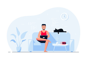 Young man at home sitting in sofa and working on computer.