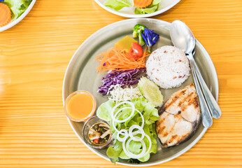 salad with fish fried and cooked rice