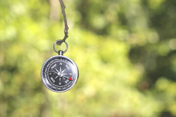 round compass on natural background as symbol of tourism with compass, travel with compass and...