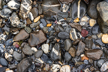 smooth pebbles by a river bank in Glarus, Switzerland