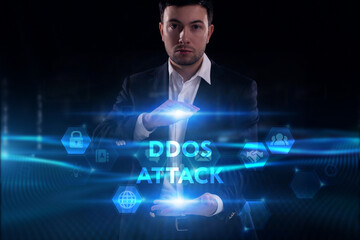 Business, Technology, Internet and network concept. Young businessman working on a virtual screen of the future and sees the inscription: Ddos attack