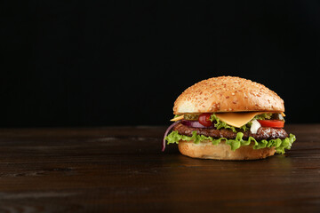 classic burger on dark background with copy space