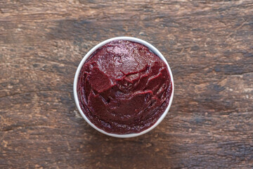 Brazilian Acai Into a Bowl on the table wooden