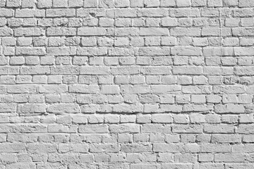 White brick wall. Loft interior design. White paint of the facade.
