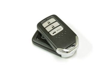New car wave key with remote control on white background, isolated.
