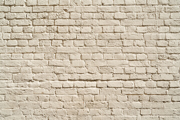 Beige brick wall. Loft interior design. Beige paint of the facade.