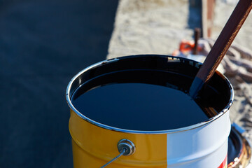 bitumen in a metal barrel