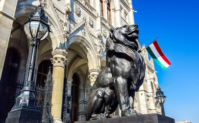Sculpture of a lion a front of Hungarian parliament. Budapest.