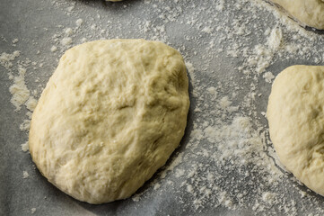 Raw little focaccia dough balls ready to be backed. Traditional Italian Focaccia homemade flat bread focaccia.