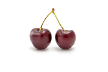 two perfect fresh cherries on a white background
