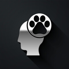 Silver Human head with animals footprint icon isolated on black background. Pet paw in heart. Love to the animals. Long shadow style. Vector.