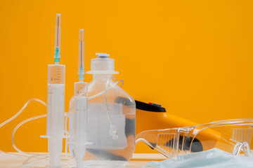 Epidemiology. Syringes and dropper. Thermal imager next to a dropper. Things epidemiologist clos...