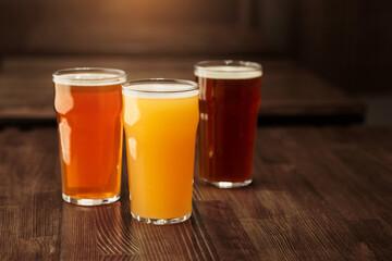 Variety of beers. Dark, light, unfiltered drink on table